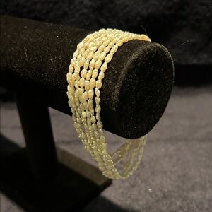 Bracelet, Small Fresh Water Pearls. Seven Strand with Slide In Clasp